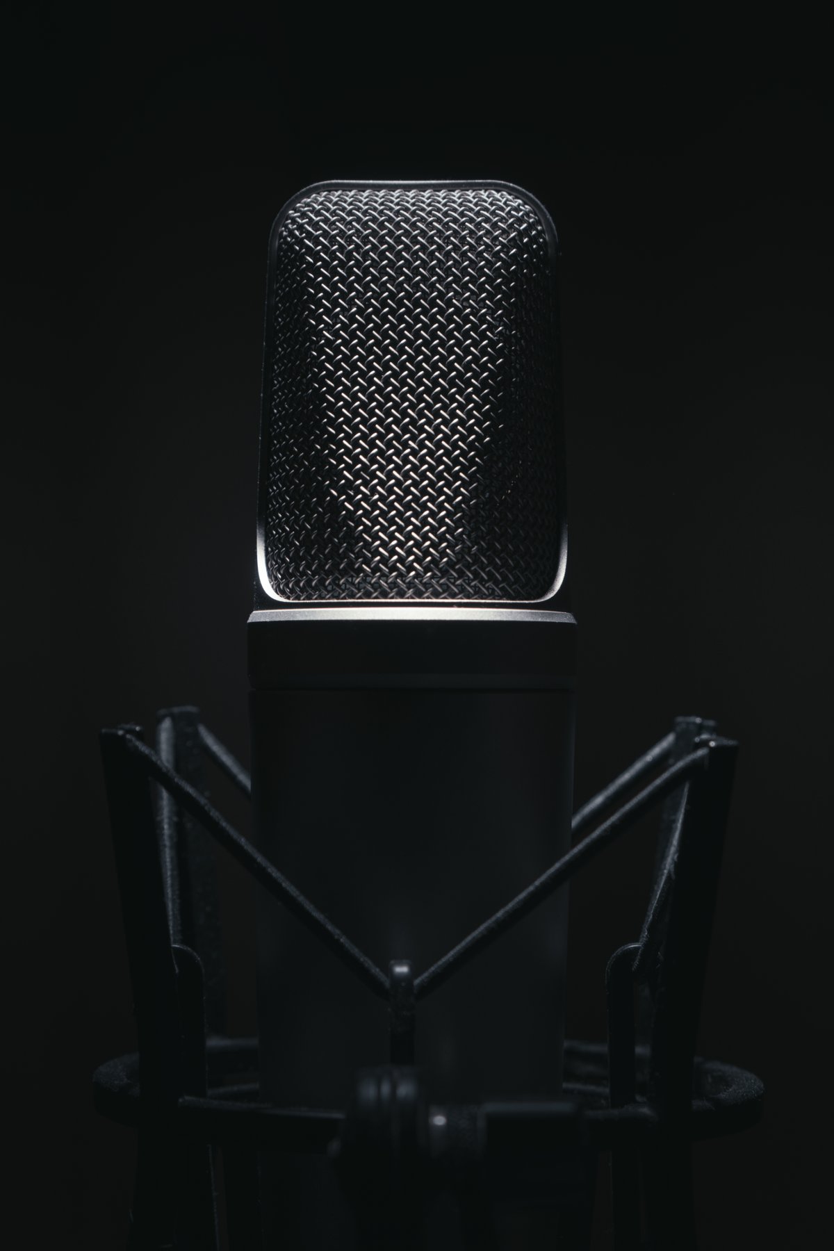 A studio microphone in low light
